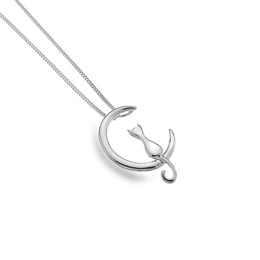 silver cat sat on a cresent moon pendant