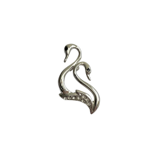 Silver tone double swan brooch with white stone detail