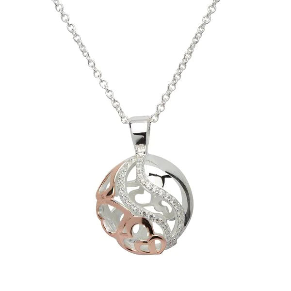 Silver, rose gold detail and cubic zirconia patterned ball pendant